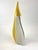 A stunning burst of yellow on white, this Murano glass vase is a beautiful representation of Murano glass art. The vase...