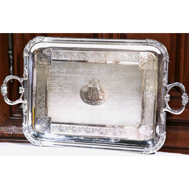 Refined engraving and handsome proportions distinguish this antique French serving tray by Pelloutier & Cie. Crafted in...