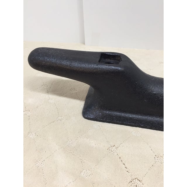 Large and heavy ship cleat in solid iron. Super condition and sealed in rust neutralizing and preventive topcoat. Massive...