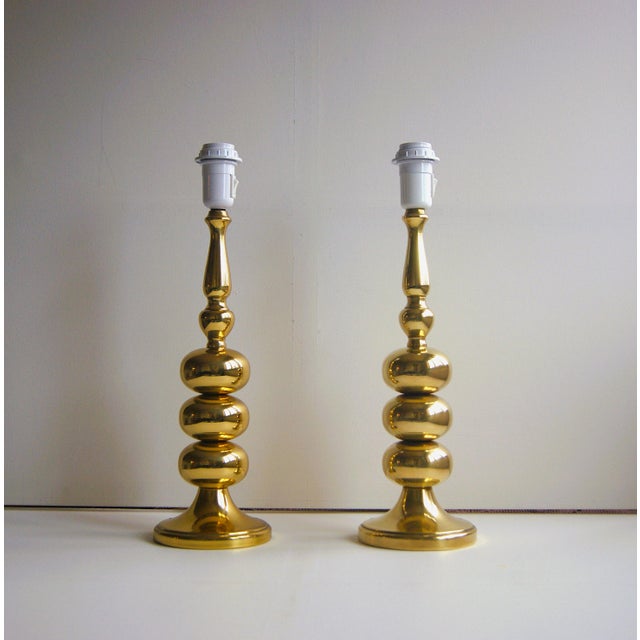 Pair of large brass table lamps in "stacked ball" design from Frandsen Denmark. Mid-century Hollywood Regency from the...