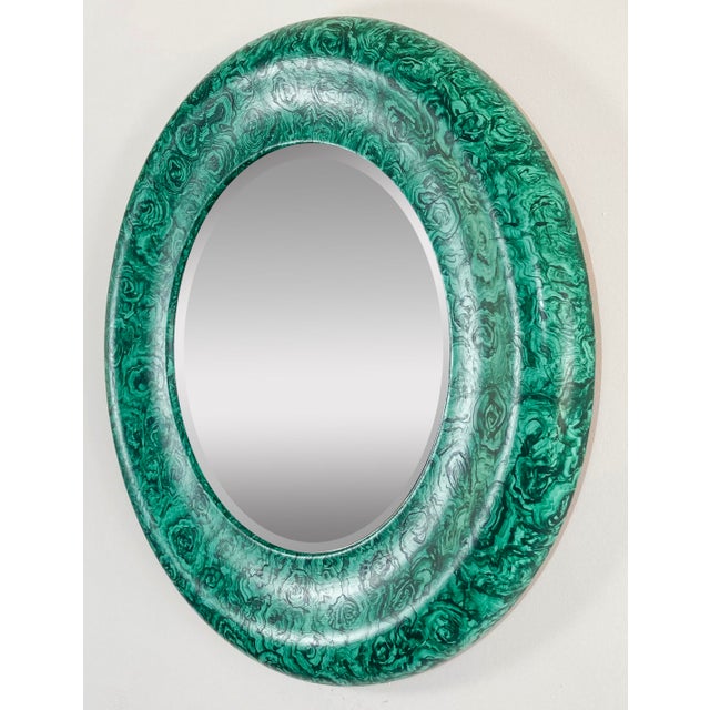 Stunning vintage hand-painted faux malachite wall mirror. Round with substantial rounded frame around a beveled glass...