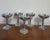 Set of 5 vintage Plator Silverstone silverplate goblets made in Spain. Features shallow coupe bowls with ornate grapevine-...