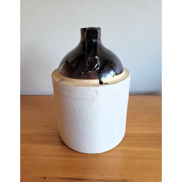 Antique Whisky Jug, this "Primitive" antique whiskey jug has a simple, utilitarian design, handcrafted nature, and a focus...