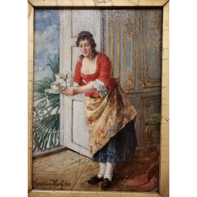 A beautiful painting on board of a woman with a tray in an interior scene by listed German artist Hermann Koch (1856-1939)...