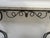 Art Deco style console table in hammered wrought iron Two curved legs with a geometric motif Breccia marble top Good...