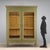 Directoire walnut wardrobe, lacquered and painted. Front with a pair of glass doors, glass panels replacing the original...