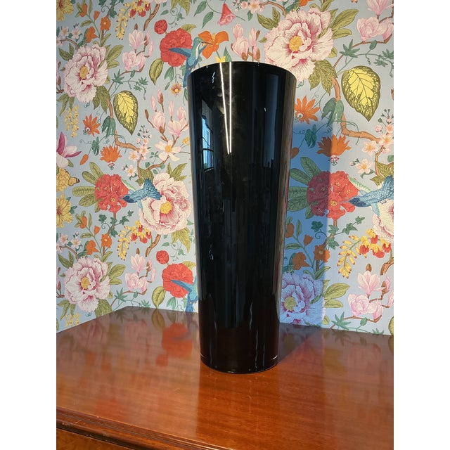 Striking unmarked black vase with a sleek, minimalist silhouette that complements a wide range of interiors. In great...