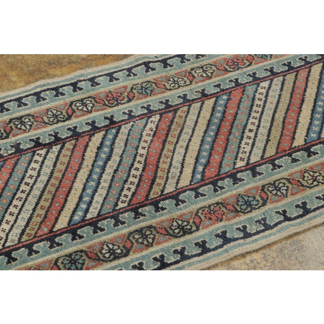 This antique 2x7 Persian Kurdish runner from Rug & Kilim is a finely woven tribal piece dating to circa 1900–1920....