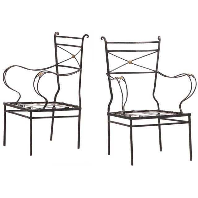 A striking pair of Argentine Neoclassical style bronze-mounted iron open armchairs, attributed to Comte, circa 1940....