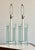 This is a pair of postmodern table lamps constructed from panels of clear and frosted glass set into a brushed aluminum...
