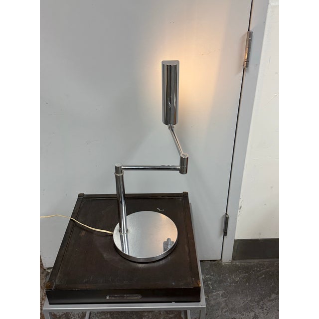 Design Plus Gallery presents a Vintage Koch & Lowy Swing Arm Chrome Desk Lamp. It's an articulating swing-arm lamp,...