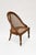 Each with curved caned back within a molded teak surround; with loose cut velvet seat cushion over a seat rail and turned...