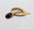 1960s Vintage 1960s Signed Crown Trifari Goldtone Cabochon Faux-Amethyst Brooch For Sale - Image 5 of 6