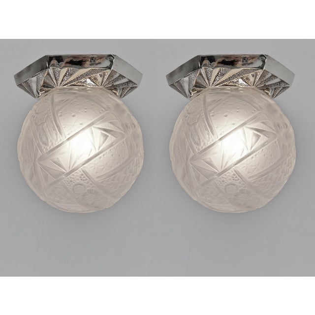Muller freres A beautiful pair of French art deco flush mounts. The bases in nickel plated solid brass or bronze hold...