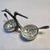 An elegant tabletop serving piece inspired by classic vintage entertaining accessories. Featuring a sculptural pair of...