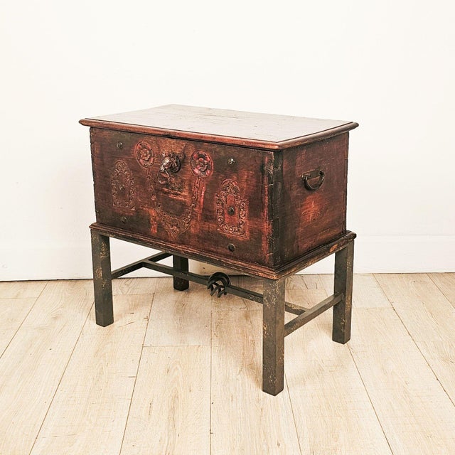 A Southeast Asian teak merchant's trunk with good carving, metalwork, and partially painted surface. 19th century or...