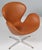 The swan chair, new upholstered in cognac aniline leather. with tilt function Made by Fritz Hansen. New upholstered. This...