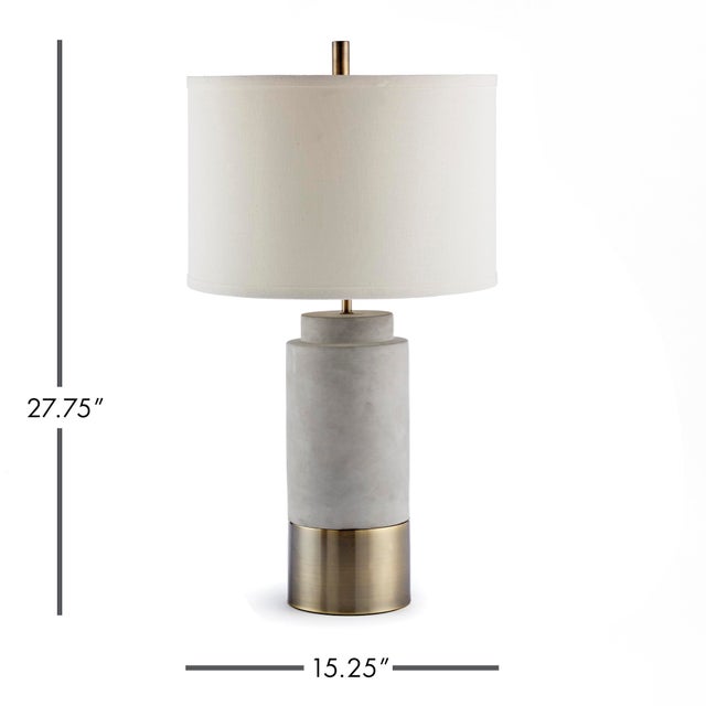 An unexpected mix of cement and brass accents make the Scully Cylinder lamp a stand out piece. The tall, narrow base and...