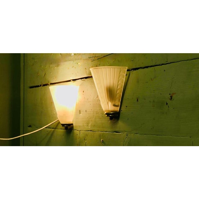 Pair of Art Deco Wall Lights A very Pretty pair in the Art Deco style, the wall lights have never been installed so they...