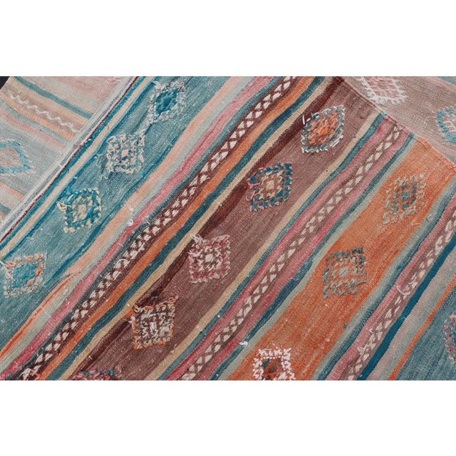 Mid 20th Century Mid 20th Century Vintage Turkish Gallery Kilim With Stripes and Tribal Motifs in Muted Tones For Sale - Image 12 of 13