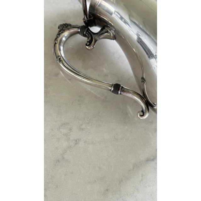 Stunning silver plate coffee pot with ornate spout, handle, and top. The coffee pot is in great condition needs some...