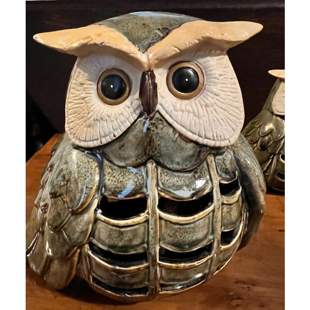 A pair of vintage Japanese glazed stoneware owl candle lanterns, beautifully modelled in two graduated sizes. The owls are...