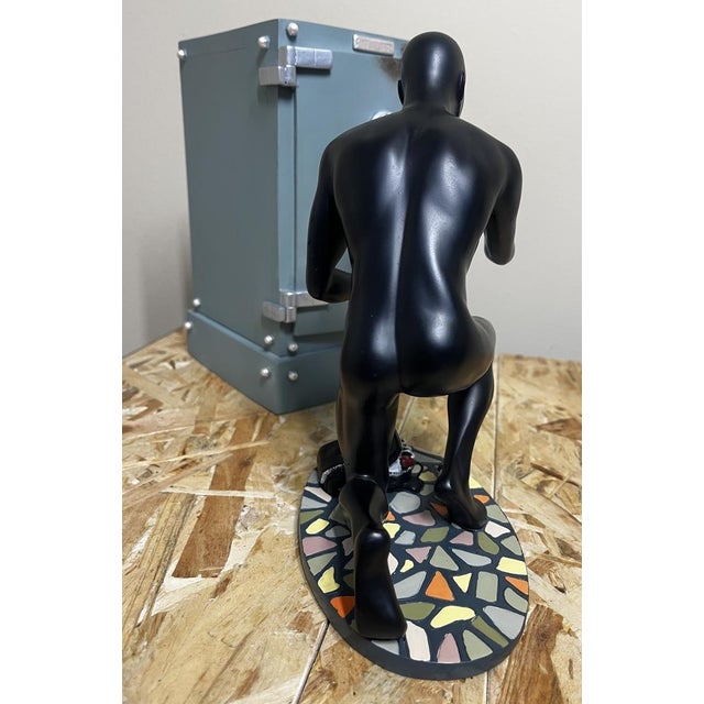 Beautiful limited-edition figure depicting diabolik breaking into a safe. Hand-painted. the safe also serves as a...