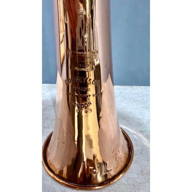 An impressive 44-inch antique English coaching horn by Boosey & Co., one of London's leading makers of brass instruments...