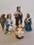 This four-piece Nativity grouping brings together Saint Joseph with his staff, the kneeling Virgin Mary, the Infant Jesus...
