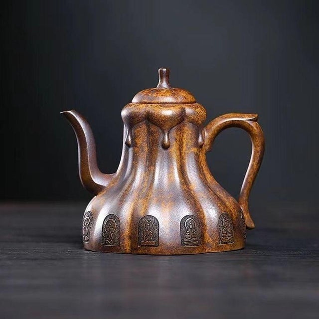 This exceptional Yixing Zisha teapot is handcrafted from high temp fired Duanni clay, prized for its warm sandy tone, fine...
