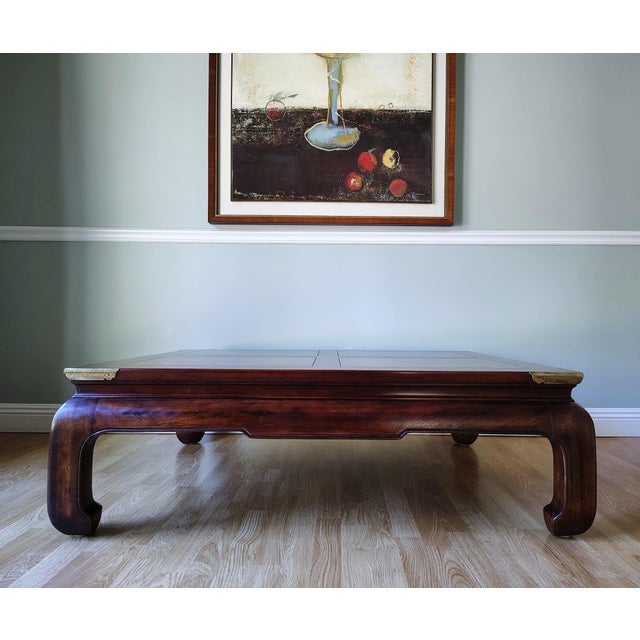 This beautiful Ming Campaign coffee table is made by Henredon. It is made of solid mahogany wood with Ming style curved...