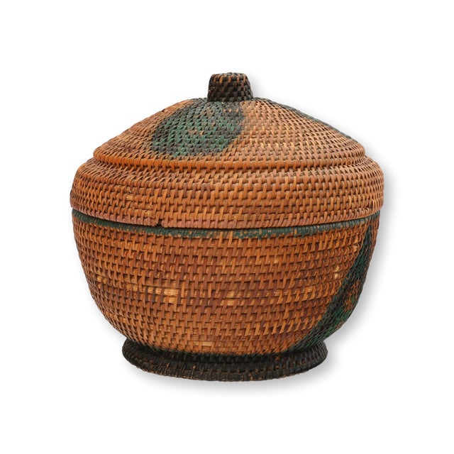 A finely woven American Art Deco lidded rattan basket dating to the 1920s, with a domed fitted lid and striking geometric...