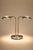 An elegant twin light table lamp designed by Jan des Bouvrie a pivotal figure in Dutch minimalist design The brushed metal...