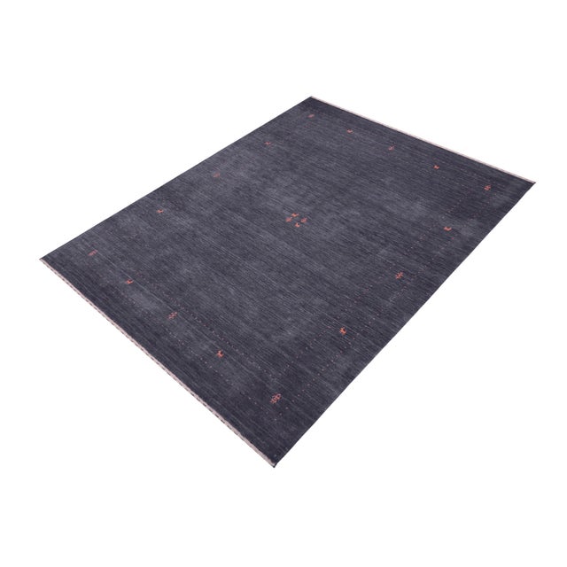 Make a bold statement in your living area with this exquisite Contemporary Gabbeh Wool Rug. It is meticulously hand-...