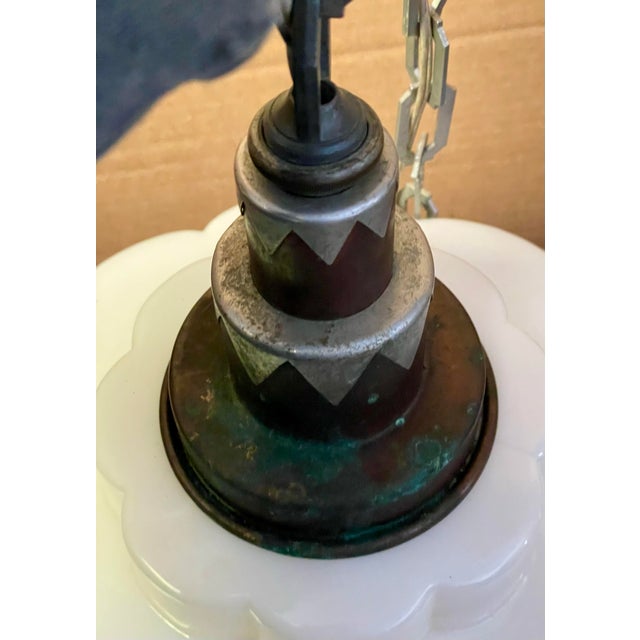 Here is a fantastic Art Deco bulbous milk glass light fixture with a traditional curved skyscraper shape to the glass and...
