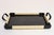 Art Deco tray with cream and black raffia-esque rubber webbing with inset glass over a painted black wooden surface...