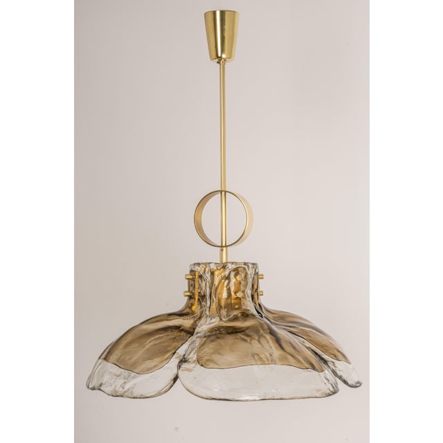 A stunning murano smoked glass chandelier designed by kalmar , austria manufactured in the 1960s. The chandelier is...