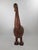 Large wood carved bird with coloured details. Consists of two pieces seperated by the neck. Measuements: 123 cm tall, 35...