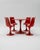 The Tulip dining set, featuring a central table and four matching chairs, boasts organic lines and a space-age spirit....