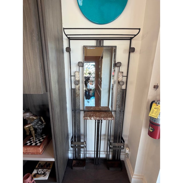 French Art deco period entry piece. Crafted from wrought and hand-hammered iron featuring varied textures. The quality of...