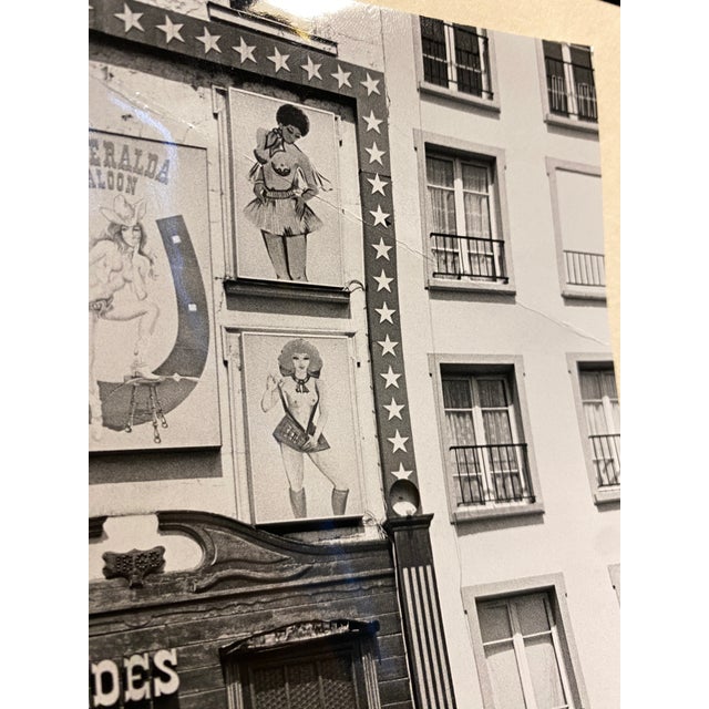 1984 black and white photograph by Los Angeles photographer Don Ware (1921-2006) of a the Pigalle in Paris. Title, dated...