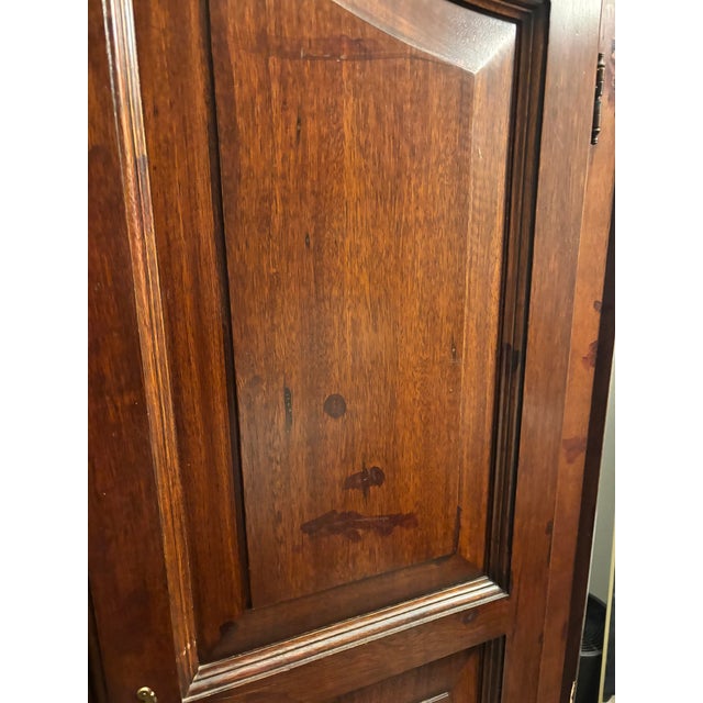 Solid wood stained walnut Selva wardrobe. 2 doors, 2 hanging bars, 5 interior shelves, 2 drawers. One drawer pull missing