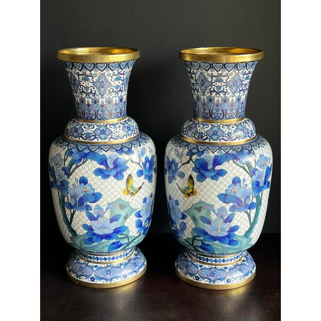 Vintage pair of large, high quality 15.25” Chinese cloisonné vases with rare Ming blue and white coloration. These vases...