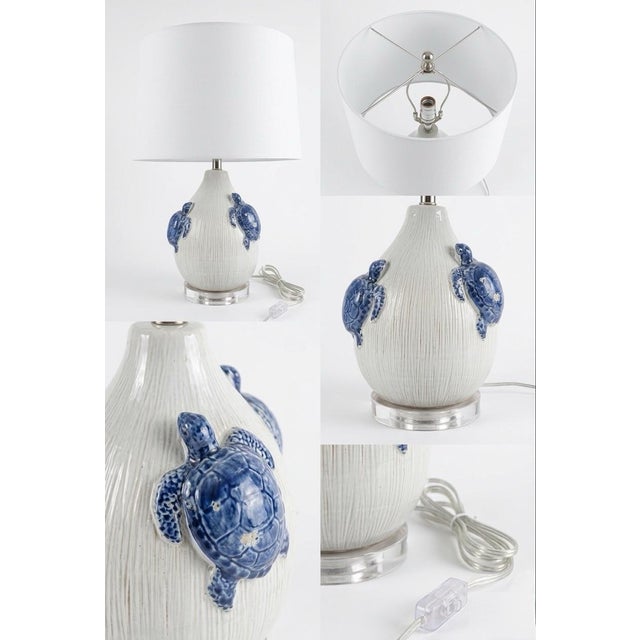 This charming vintage Italian ceramic table lamp features a classic teardrop-shaped base with a unique, textured ribbed...