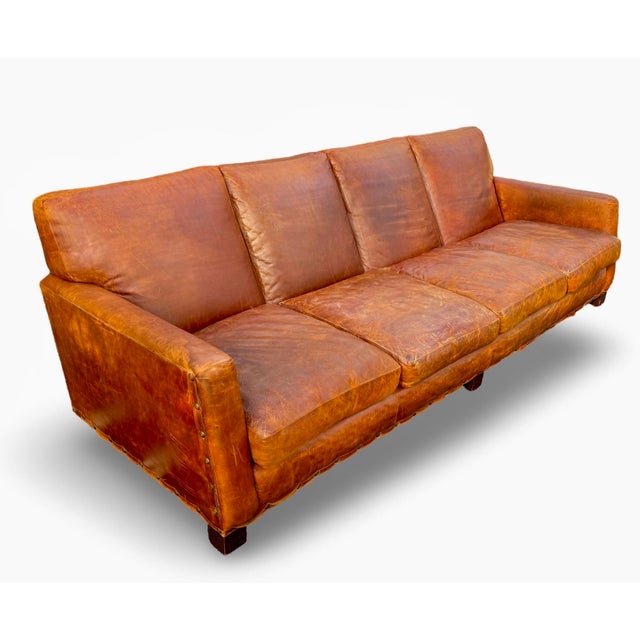 Vintage brown leather sofa by Ralph Lauren. This is a four-seater model in distressed calf leather. Solid mahogany wood...
