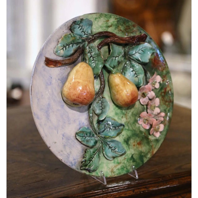 Decorate a kitchen wall, breakfast room, or dining area with this vibrant antique Barbotine faience wall plate. Crafted in...