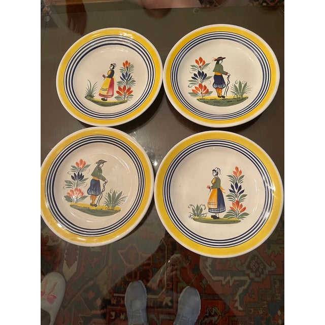Charming mid-century collection of authentic, hand-painted Henriot Quimper faience pottery dinnerware, orginally acquired...