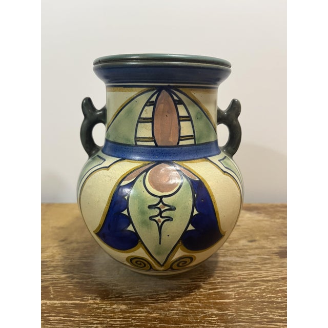 This magnificent two-handled vase is an authentic specimen of the "damascus" decor from plateelbakkerij zuid-holland...