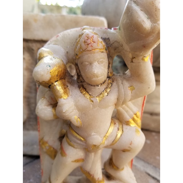 A hand carved marble statue of the Hindu monkey god Hanuman. Found in Pushkar India. Part of a holy shrine, this piece was...