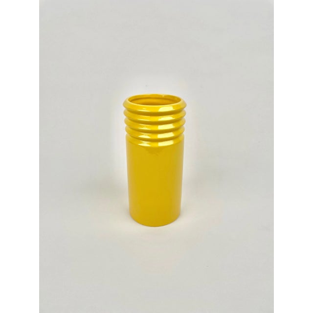 Cylindric vase in yellow ceramic by Il Picchio. Made in Italy in the 1960s. The original signature "Il Picchio Italy" is...